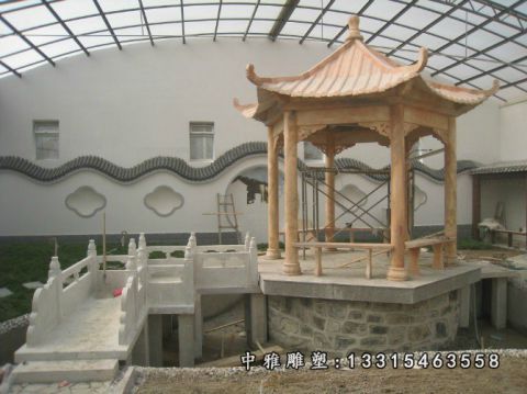 公园晚霞红石雕凉亭
